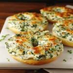 Cheesy Spinach-Artichoke Bagels